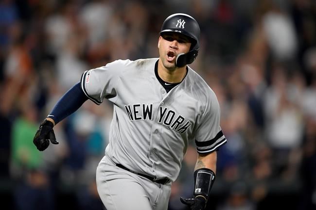 New York Yankees' Gary Sanchez reacts as he heads to first to round the bases after hitting a three-run home run during the ninth inning of a baseball game against the Baltimore Orioles, Monday, May 20, 2019, in Baltimore. (AP Photo/Nick Wass)