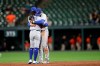 Toronto Blue Jays shortstop Bo Bichette, left, hugs second baseman Cavan Biggio after the Blue Jays defeated the Baltimore Orioles 8-5 in a baseball game Tuesday, Sept. 17, 2019, in Baltimore. (AP Photo/Julio Cortez)