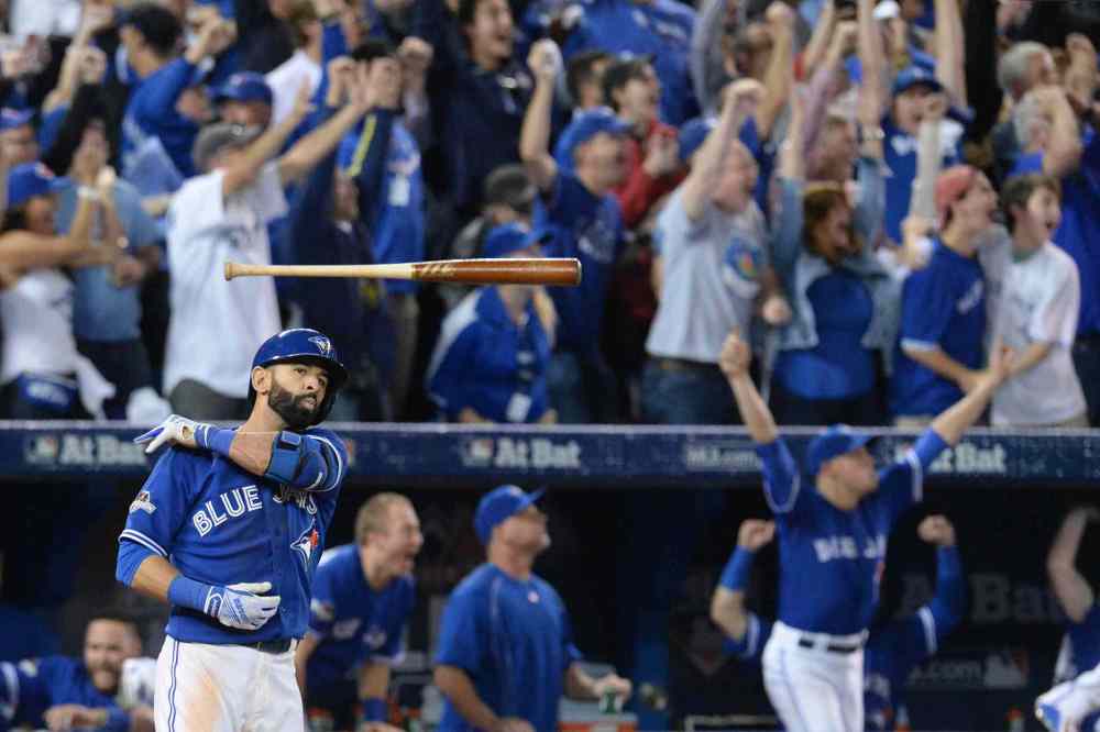 CP
Toronto Blue Jays' Jose Bautista tosses his bat after hitting a three-run home run during seventh inning game five American League Division Series baseball action against the Texas Rangers in Toronto on Wednesday, October 14, 2015. THE CANADIAN PRESS/Chris Young