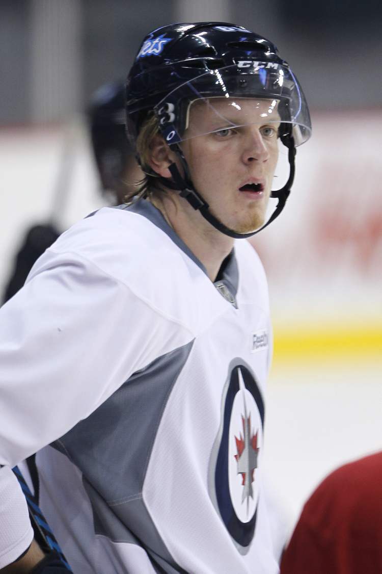 John Woods / The Canadian Press
Winnipeg Jet Axel Blomqvist (65), from Sweden, during practice on the fourth day of NHL hockey training camp Saturday in Winnipeg. He has signed an entry-level contract with the Jets.