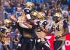 CP
Winnipeg Blue Bombers running back Will Ford, left to right, celebrates his touch down with teammates Justin Sorensen and Chris Greaves during second half CFL football action in Toronto on Friday.