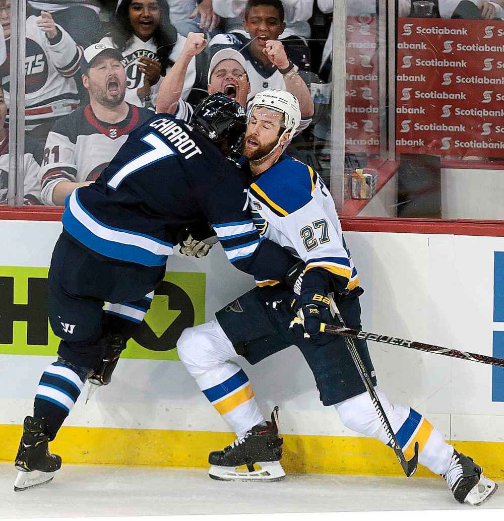 PHIL HOSSACK / WINNIPEG FREE PRESS
Winnipeg Jets' Ben Chiarot taking out St Louis Blues Captain Alex Pietrangelo in the first period, during a close-checking physical affair Wednesday in Winnipeg. Both teams expect more of the same when they meet again Friday in Game 2 of their series.