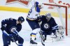 John Woods / The Canadian Press 
Winnipeg Jets goaltender Ondrej Pavelec (31) makes a save against St. Louis Blues' David Backes (42) during the first period Thursday in Winnipeg.