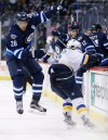 John Woods / The Canadian and Associated Press
Winnipeg Jets' Blake Wheeler (26) avoids a check from St. Louis Blues' Zbynek Michalek (right) as Jets' Drew Stafford (12) looks on.