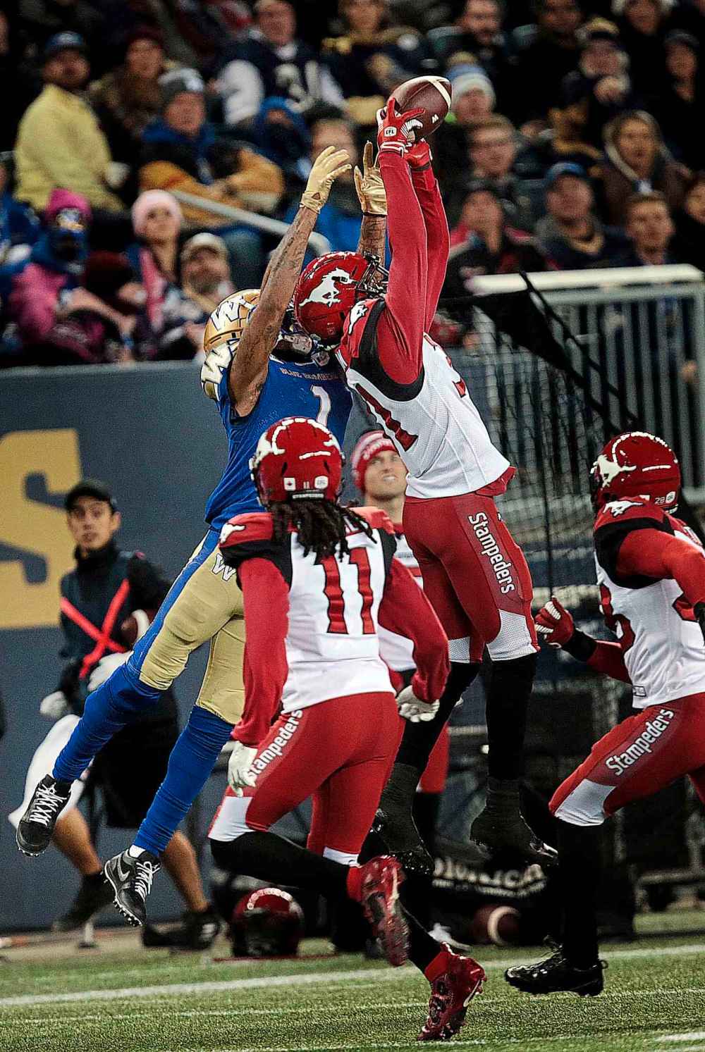 Phil Hossack / Winnipeg Free Press
Blue Bombers' receiver Darvin Adams reception is broken up by Calgary Stampeders' Tre Roberson early in the second half at IG Field Friday.