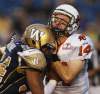 Joe Bryksa / Winnipeg Free Press
Winnipeg Blue Bomber Kenny Manor (left) runs into B.C. Lions quarterback Travis Lulay with a late hit during second-quarter CFL action at Canad Inns Stadium Friday night. He was penalized with roughing the passer.