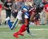 THE CANADIAN PRESS/Adrian Wyld
Winnipeg Blue Bombers defensive back Chandler Fenner, left, tackles Ottawa Redblacks wide receiver R.J. Harris during the second quarter.