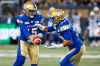 THE CANADIAN PRESS/John Woods
Winnipeg Blue Bombers quarterback Matt Nichols hands off to Andrew Harris during the first half Friday against the Alouettes. The Bombers put up 334 yards of total offence in the game.