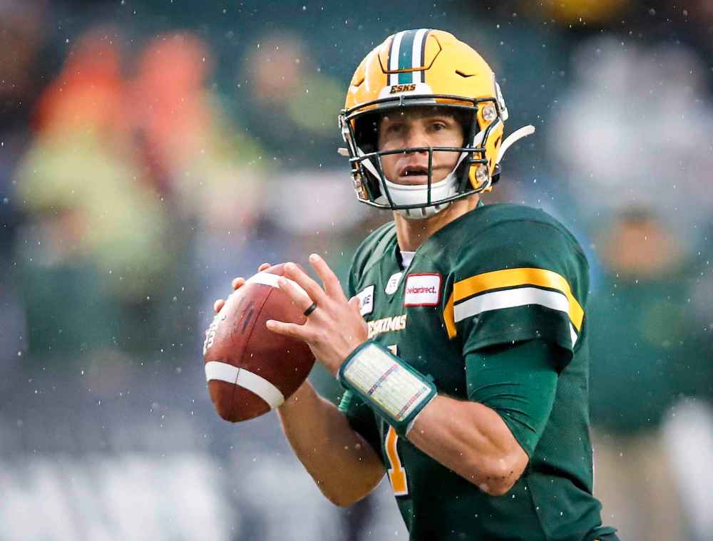 THE CANADIAN PRESS/Jeff McIntosh
Edmonton Eskimos quarterback Trevor Harris looks for a receiver during the first half against the Winnipeg Blue Bombers in Edmonton, Friday.