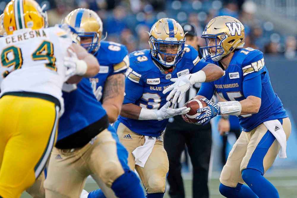 John Woods / THE CANADIAN PRESS FILES
Winnipeg Blue Bombers quarterback Matt Nichols fakes the handoff to Andrew Harris  against the Edmonton Eskimos. The two cornerstones of the Bombers offence will be crucial in a Winnipeg win.