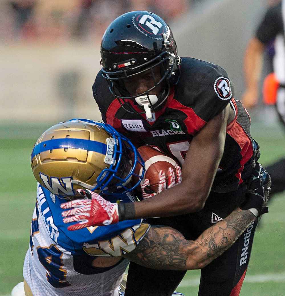 THE CANADIAN PRESS/Adrian Wyld
Winnipeg Blue Bombers fullback Mike Miller, left, is tied for second on the CFL's all-time special teams tackles list at 184.