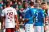 Brescia'a Mario Balotelli, center, walks on the pitch during the Serie A soccer match between Brescia and Torino at the Mario Rigamonti Stadium in Brescia, Italy, Saturday, Nov. 9, 2019. (Filippo Venezia/ANSA via AP)