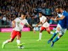 Juventus' Paulo Dybala, left, takes on Brescia's John Chancellor during the Italian Serie A soccer match between Brescia and Juventus at the Rigamonti stadium in Brescia, Italy , Tuesday, Sept. 24, 2019. (Filippo Venezia/ANSA via AP)