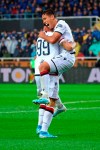 Cagliari's Christian Oliva, right, celebrates with his teammate Giovanni Simeone after scoring his side's second goal during the Italian Serie A soccer match between Atalanta and Cagliari at the Gewiss Stadium in Bergamo, Italy, Sunday, Nov. 3, 2019. (Paolo Magni/ANSA via AP)