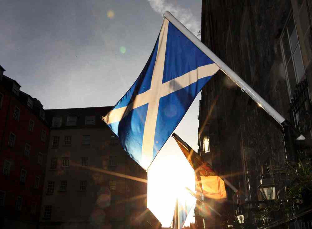 CP
A view of a Saltire flag also known as Saint Andrew's Cross, the flag of Scotland is seen flying on the side of a building in Edinburgh.