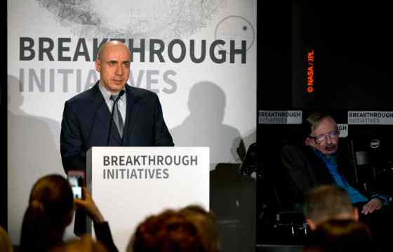 Matt Dunham / The Associated PressRussian tech entrepreneur Yuri Milner, left, speaks next to renowned physicist Stephen Hawking during a press conference in London.