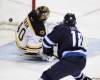 Trevor Hagan / The Canadian Press
The Jets' Bryan Little  puts the puck past Boston Bruins' goaltender Tuukka Rask Tuesday at the MTS Centre for the winning goal in a 2-1 victory.