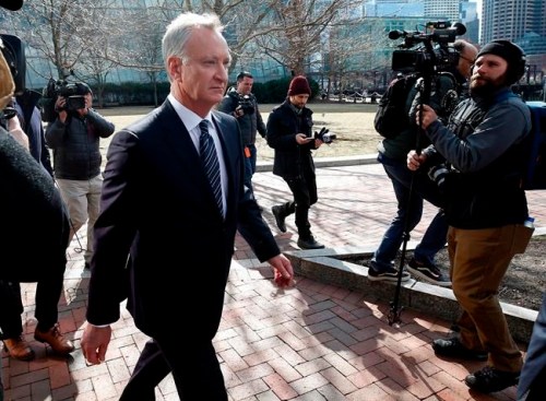 FILE - In this April 3, 2019 file photo, TobyMacFarlane departs federal court in Boston after facing charges in a nationwide college admissions bribery scandal. Authorities said Tuesday, April 23, that MacFarlane, a former senior executive at a title insurance company, will plead guilty to racketeering conspiracy and cooperate with federal authorities in the case. (AP Photos/Michael Dwyer, File)
