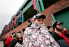 Nolan Granbusch, of Dallas, arrives at Fenway Park bundled against the cold for the home opener baseball game between the Boston Red Sox and the Toronto Blue Jays, Tuesday, April 9, 2019, in Boston. (AP Photo/Charles Krupa)