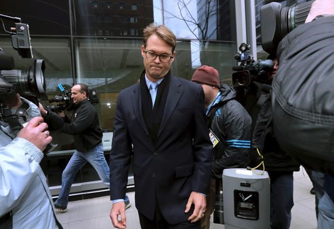 Mark Riddell departs federal court Friday, April 12, 2019, in Boston, after pleading guilty to charges in a nationwide college admissions bribery scandal. (AP Photo/Charles Krupa)
