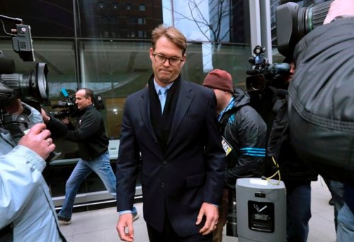 Mark Riddell departs federal court Friday, April 12, 2019, in Boston, after pleading guilty to charges in a nationwide college admissions bribery scandal. (AP Photo/Charles Krupa)