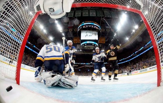 Boston Bruins' Charlie Coyle, right, celebrates his power play goal against St. Louis Blues goaltender Jordan Binnington (50) during the first period in Game 2 of the NHL hockey Stanley Cup Final against the St. Louis Blues, Wednesday, May 29, 2019, in Boston. (Bruce Bennett/Pool via AP)