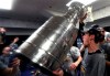 St. Louis Blues goaltender Jordan Binnington celebrates with the Stanley Cup in the locker room after defeating the Boston Bruins in Game 7 of the NHL Stanley Cup Final, Wednesday, June 12, 2019, in Boston. (Dave Sandford/Pool via AP)