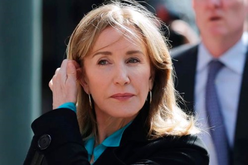 FILE - In this April 3, 2019 file photo, actress Felicity Huffman arrives at federal court in Boston to face charges in a nationwide college admissions bribery scandal. Huffman, who pleaded guilty to a single count of conspiracy and fraud in May, is returning for sentencing in federal on Friday, Sept. 13, 2019 court in Boston. (AP Photo/Charles Krupa, File)