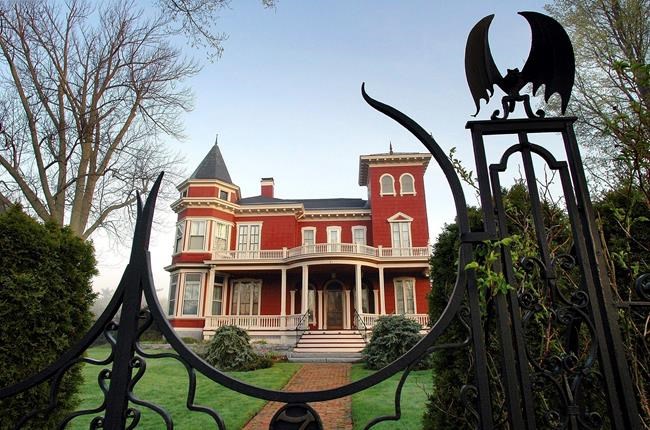 FILE - This May 16, 2005, file photo shows the home of author Stephen King in Bangor, Maine. The horror writer and his wife have petitioned the city of Bangor for a zoning change for the home where they raised their children. If approved, the mansion will become home to Stephen King’s archives, and a guest house next door will become home to writers in residence. (AP Photo/Robert F. Bukaty, File)