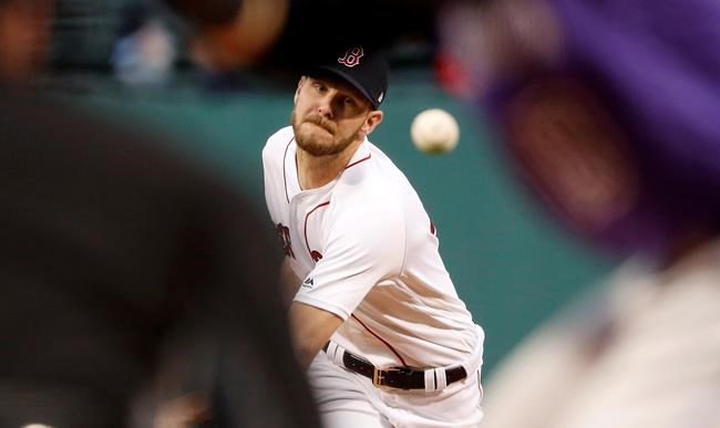 Boston Red Sox starting pitcher Chris Sale delivers against the Colorado Rockies during the first inning of a baseball game Tuesday, May 14, 2019, at Fenway Park in Boston. (AP Photo/Winslow Townson)