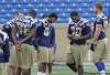 Wayne Glowacki / Winnipeg Free Press
Subdued Winnipeg Blue Bomber players at the start of a light practice Wednesday the day after their defensive line and assistant head coach Richard Harris died suddenly.