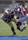 TREVOR HAGAN / WINNIPEG FREE PRESS
Winnipeg Blue Bomber Emmanuel Marc puts his head down and blasts through Steven Holness of the Montreal Alouettes to score during the Bomber 34-10 win Sunday in Winnipeg.