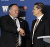 Wayne Glowacki / Winnipeg Free Press
New Winnipeg Blue Bomber acting CEO Wade Miller, left, shakes the hand of board chair Brock Bulbuck this morning.