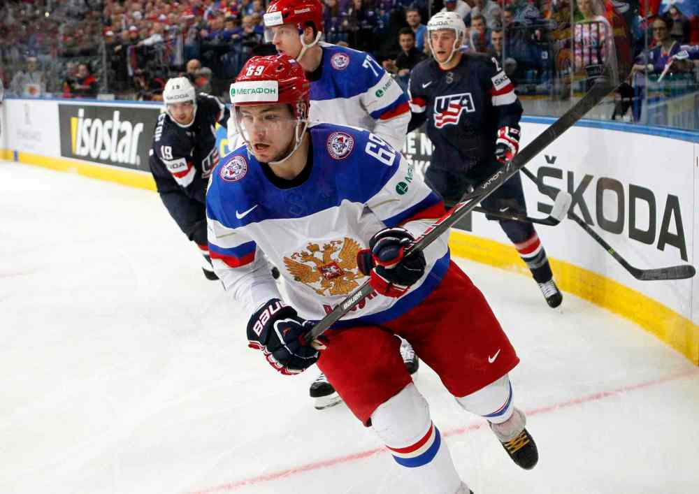 Darko Bandic / Associated Press files
Russia forward Alexander Burmistrov goes for the puck during a match between Russia and USA at the 2014 Ice Hockey World Championship in Minsk, Belarus.