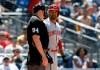 Cincinnati Reds' Matt Kemp, right, talks with umpire Lance Barrett after being called out on strikes during the fourth inning of a baseball game against the San Diego Padres in San Diego, Sunday, April 21, 2019. (AP Photo/Alex Gallardo)