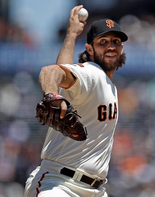 San Francisco Giants pitcher Madison Bumgarner works against the Arizona Diamondbacks in the first inning of a baseball game Sunday, June 30, 2019, in San Francisco. (AP Photo/Ben Margot)