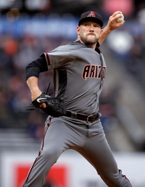 Arizona Diamondbacks pitcher Alex Young works against the San Francisco Giants in the first inning of a baseball game Thursday, June 27, 2019, in San Francisco. (AP Photo/Ben Margot)