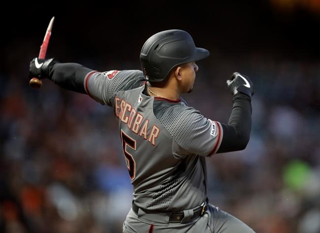 Arizona Diamondbacks' Eduardo Escobar breaks his bat after hitting a single off San Francisco Giants' Drew Pomeranz during the fifth inning of a baseball game Saturday, June 29, 2019, in San Francisco. (AP Photo/Ben Margot)