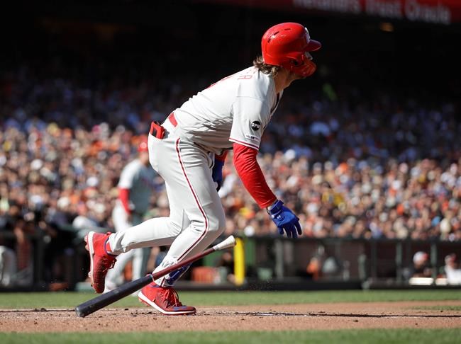Philadelphia Phillies' Bryce Harper drops his bat after hitting a two-run single off San Francisco Giants' Conner Menez in the second inning of a baseball game Sunday, Aug. 11, 2019, in San Francisco. (AP Photo/Ben Margot)