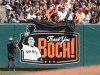 Fans unveil artwork on the left field wall dedicated to manager Bruce Bochy during the baseball game against the San Diego Padres Sunday, Sept. 1, 2019, in San Francisco. Bochy will retire from Major League baseball at the end of the 2019 season. (AP Photo/Ben Margot)