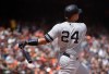 New York Yankees' Gary Sanchez swings for a grand slam off San Francisco Giants' Derek Holland in the fifth inning of a baseball game Saturday, April 27, 2019, in San Francisco. (AP Photo/Ben Margot)
