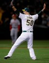 Oakland Athletics' Mike Fiers celebrates after pitching a no hitter against the Cincinnati Reds at the end of a baseball game Tuesday, May 7, 2019, in Oakland, Calif. (AP Photo/Ben Margot)