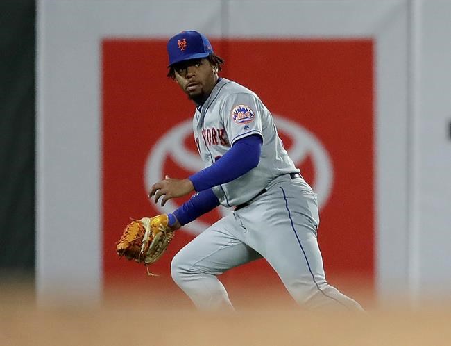 New York Mets left fielder Dominic Smith watches the game winning run score after failing to make the catch on a ball hit by San Francisco Giants' Pablo Sandoval in the tenth inning of a baseball game Friday, July 19, 2019, in San Francisco. Smith received an error on the play. (AP Photo/Ben Margot)