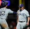 San Diego Padres pitcher Kirby Yates, right, celebrates with Austin Hedges after the team's 4-1 win over the San Francisco Giants in a baseball game Saturday, Aug. 31, 2019, in San Francisco. (AP Photo/Ben Margot)