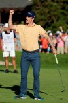 Justin Rose, of England, celebrates his win on the 18th green of the South Course at Torrey Pines golf course after winning the Farmers Insurance golf tournament Sunday, Jan. 27, 2019, in San Diego. (AP Photo/Gregory Bull)