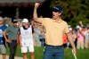 Justin Rose, of England, celebrates his win on the 18th green of the South Course at Torrey Pines golf course after winning the Farmers Insurance golf tournament Sunday, Jan. 27, 2019, in San Diego. (AP Photo/Gregory Bull)