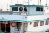 FBI investigators climb aboard the 