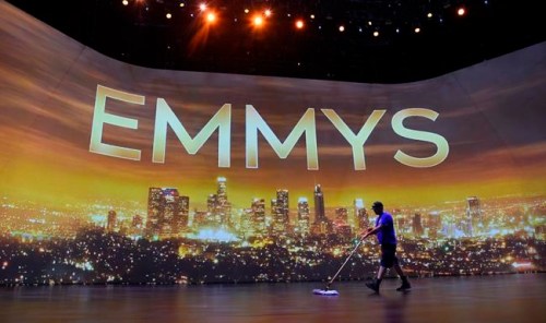 Crew member Brent Tillema sweeps the stage during Press Preview Day for the 71st Primetime Emmy Awards, Thursday, Sept. 19, 2019, at the Microsoft Theater in Los Angeles. (Photo by Chris Pizzello/Invision/AP)
