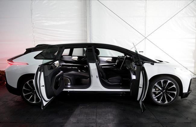 The Faraday Future FF 91, a long, low, and luxurious four-door EV is shown during the