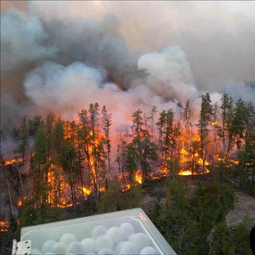 ONTARIO NORTHWEST REGION FOREST FIRE MANAGEMENT CENTR
The wildfire near the popular Caddy Lake resort area has hit the point where South Cross and North Cross lakes connect by a train tunnel.